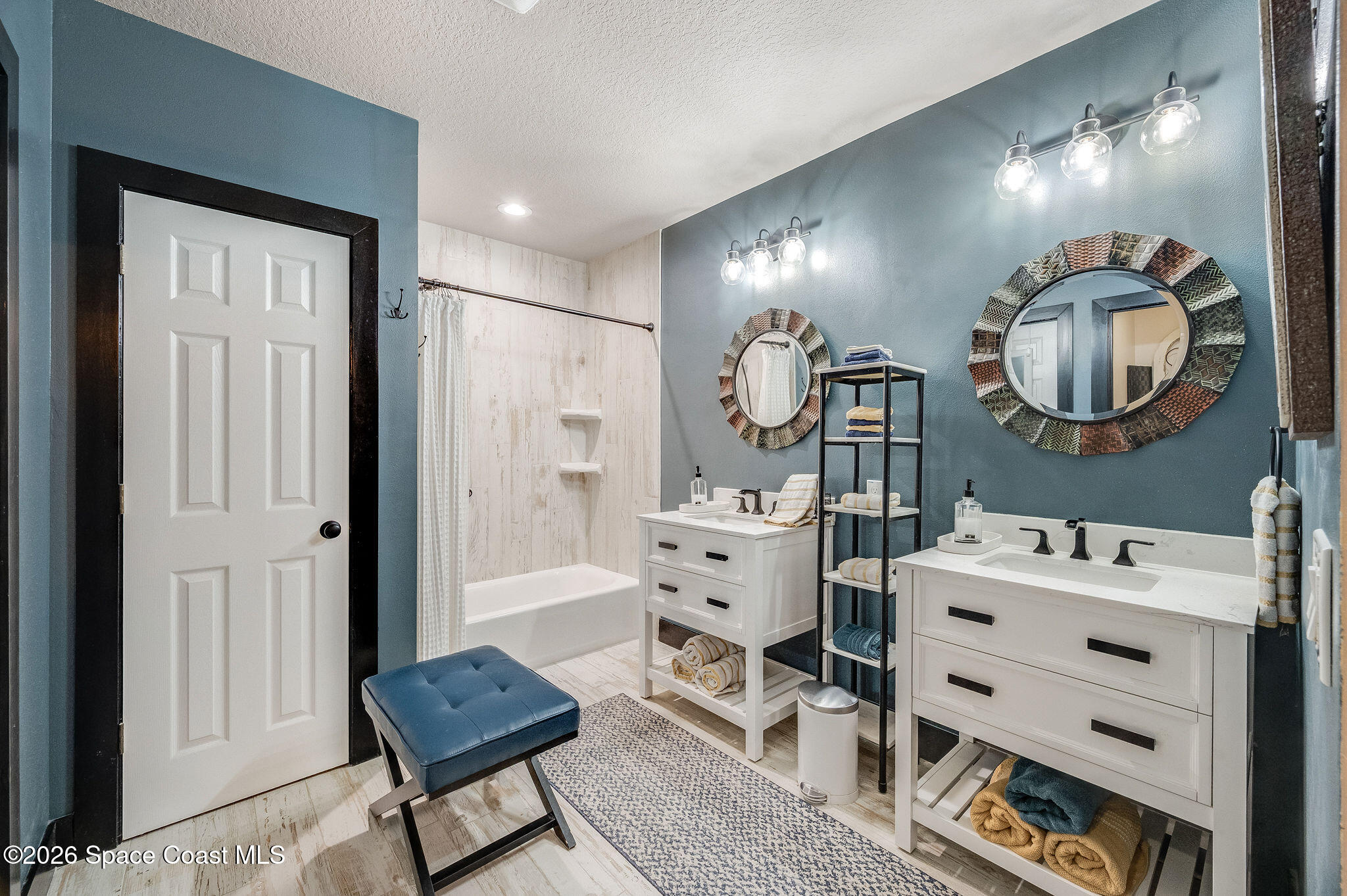 3911 Joslin Way Melbourne, FL 32904 - Photo 34 of 63 a room with a baby crib furniture a mirror and a window