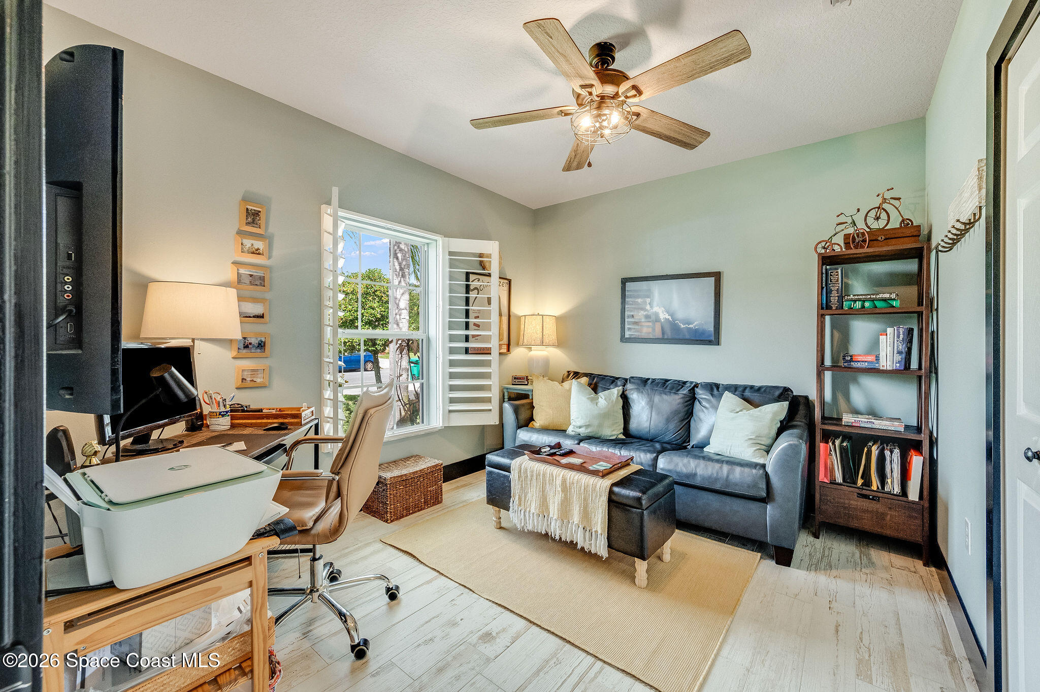 3911 Joslin Way Melbourne, FL 32904 - Photo 37 of 63 a living room with furniture and a flat screen tv