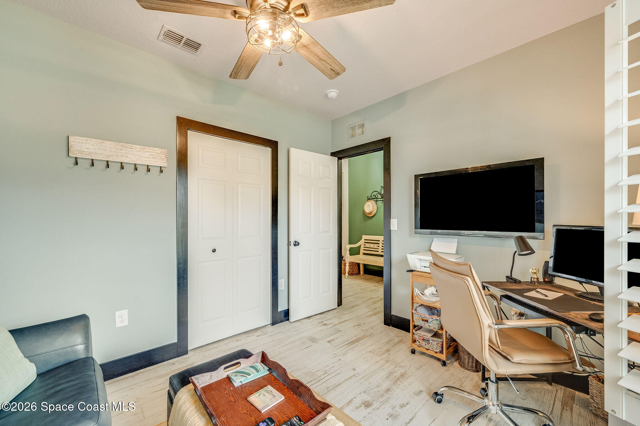 3911 Joslin Way Melbourne, FL 32904 - Photo 39 of 63 a bedroom with a bed and a flat screen tv