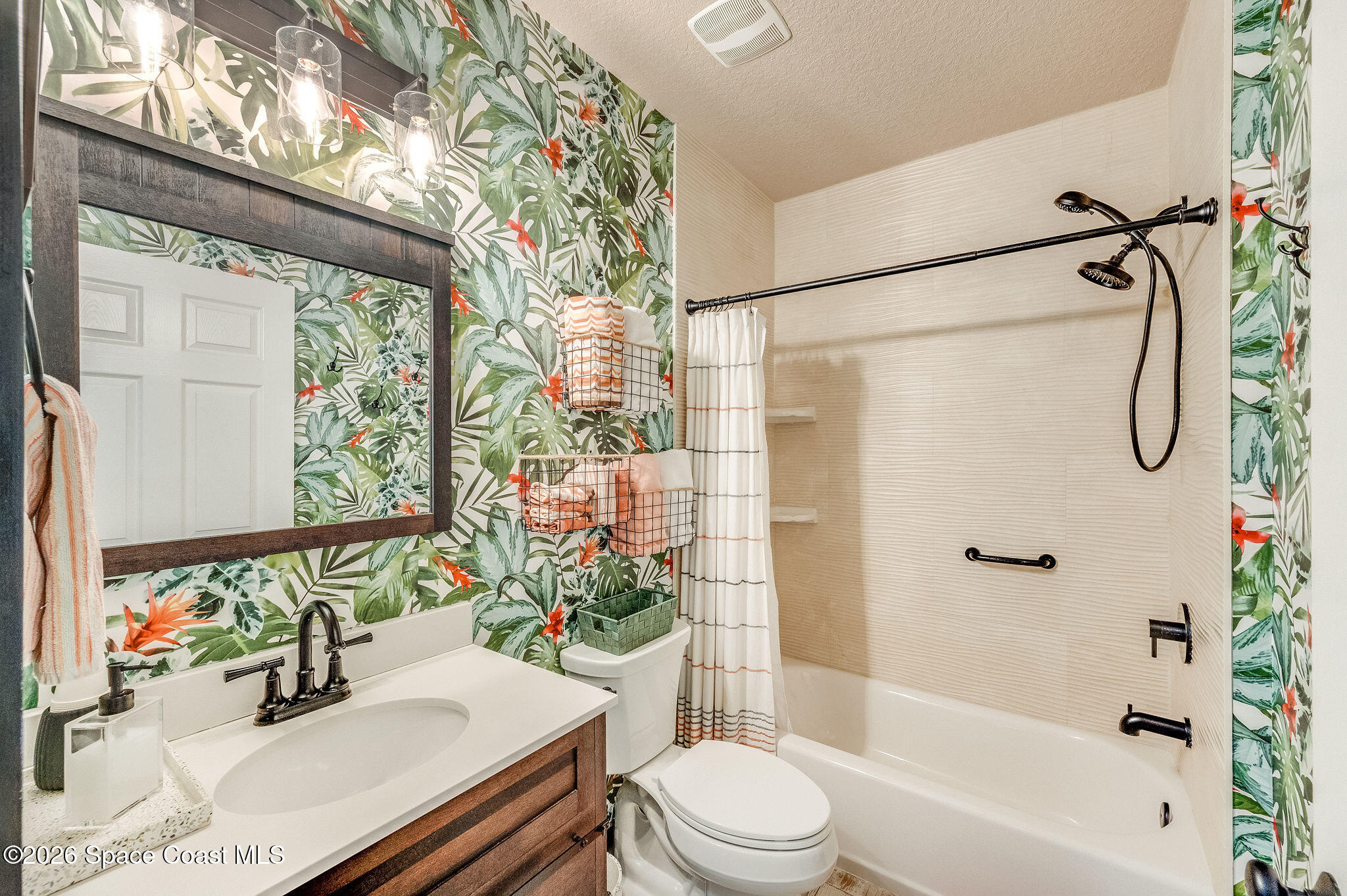 3911 Joslin Way Melbourne, FL 32904 - Photo 41 of 63 a bathroom with a sink toilet and shower