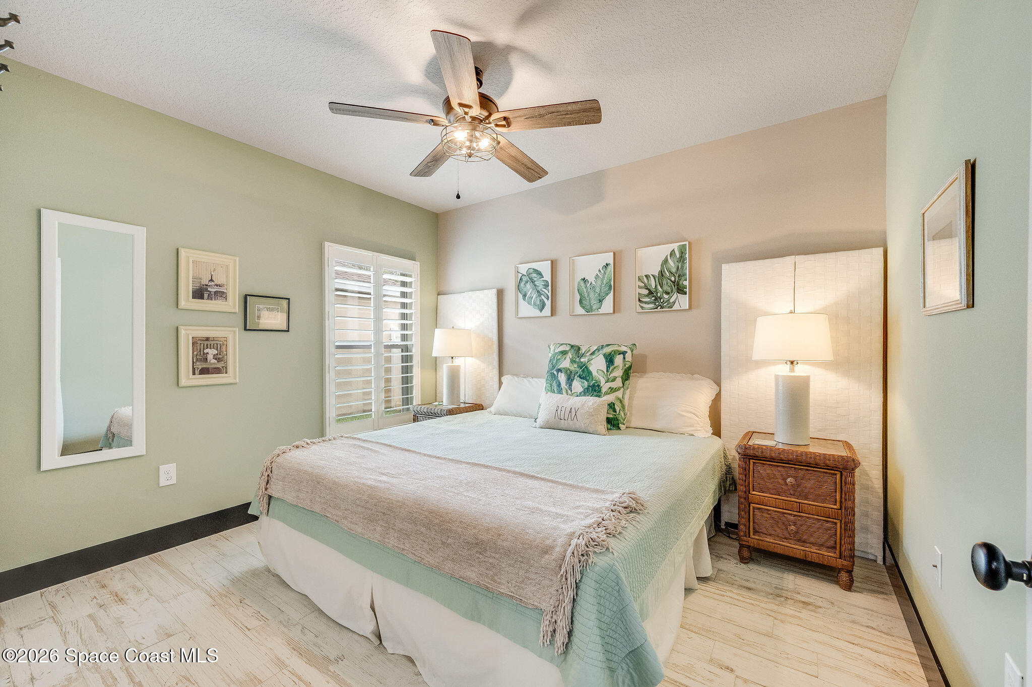 3911 Joslin Way Melbourne, FL 32904 - Photo 42 of 63 a bedroom with a bed and a chandelier