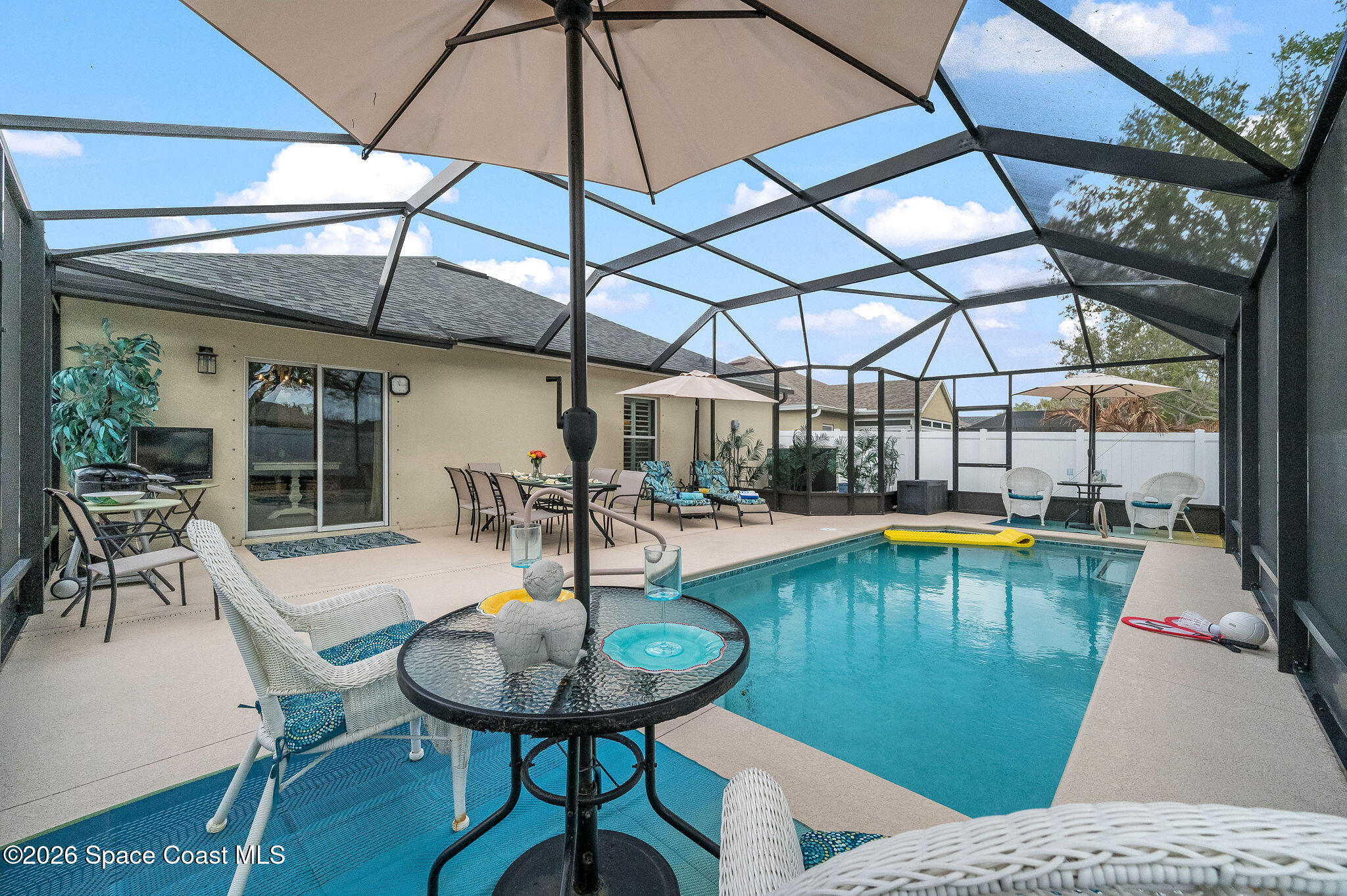 3911 Joslin Way Melbourne, FL 32904 - Photo 43 of 63 a swimming pool with outdoor seating