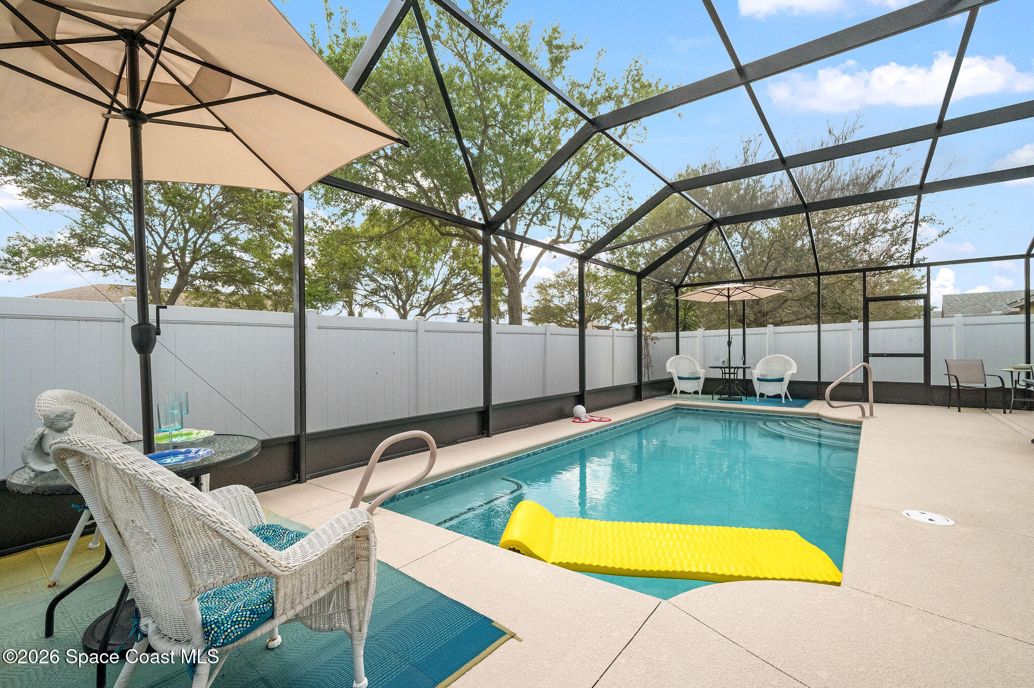 3911 Joslin Way Melbourne, FL 32904 - Photo 47 of 63 a view of a swimming pool with a patio and a yard