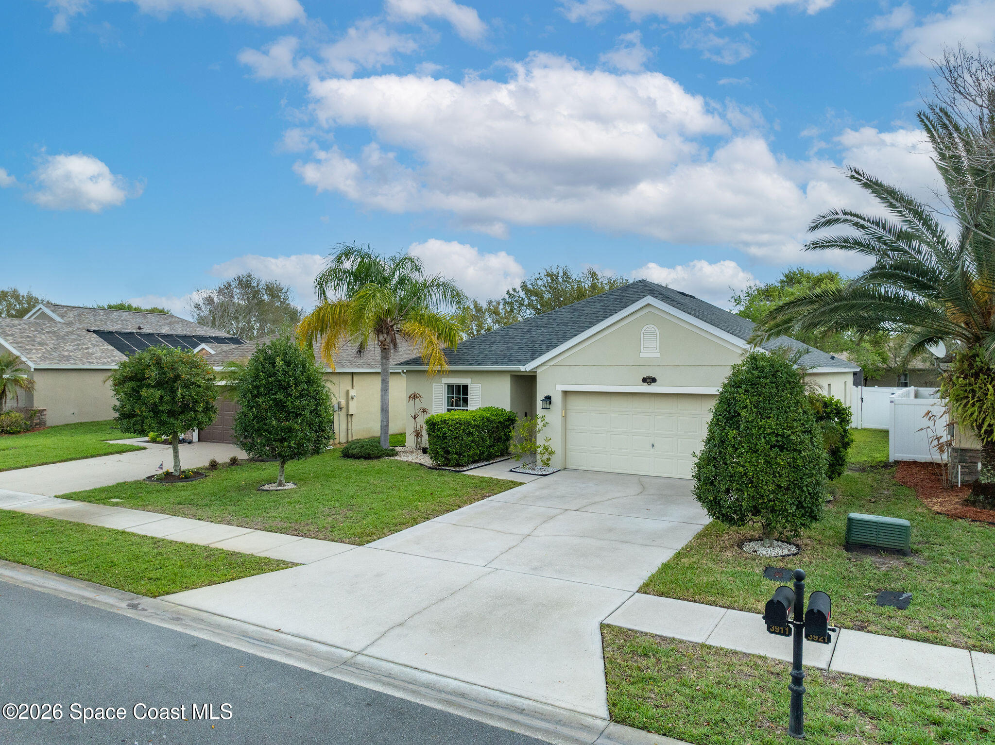 3911 Joslin Way Melbourne, FL 32904 - Photo 55 of 63 a front view of a house with garden