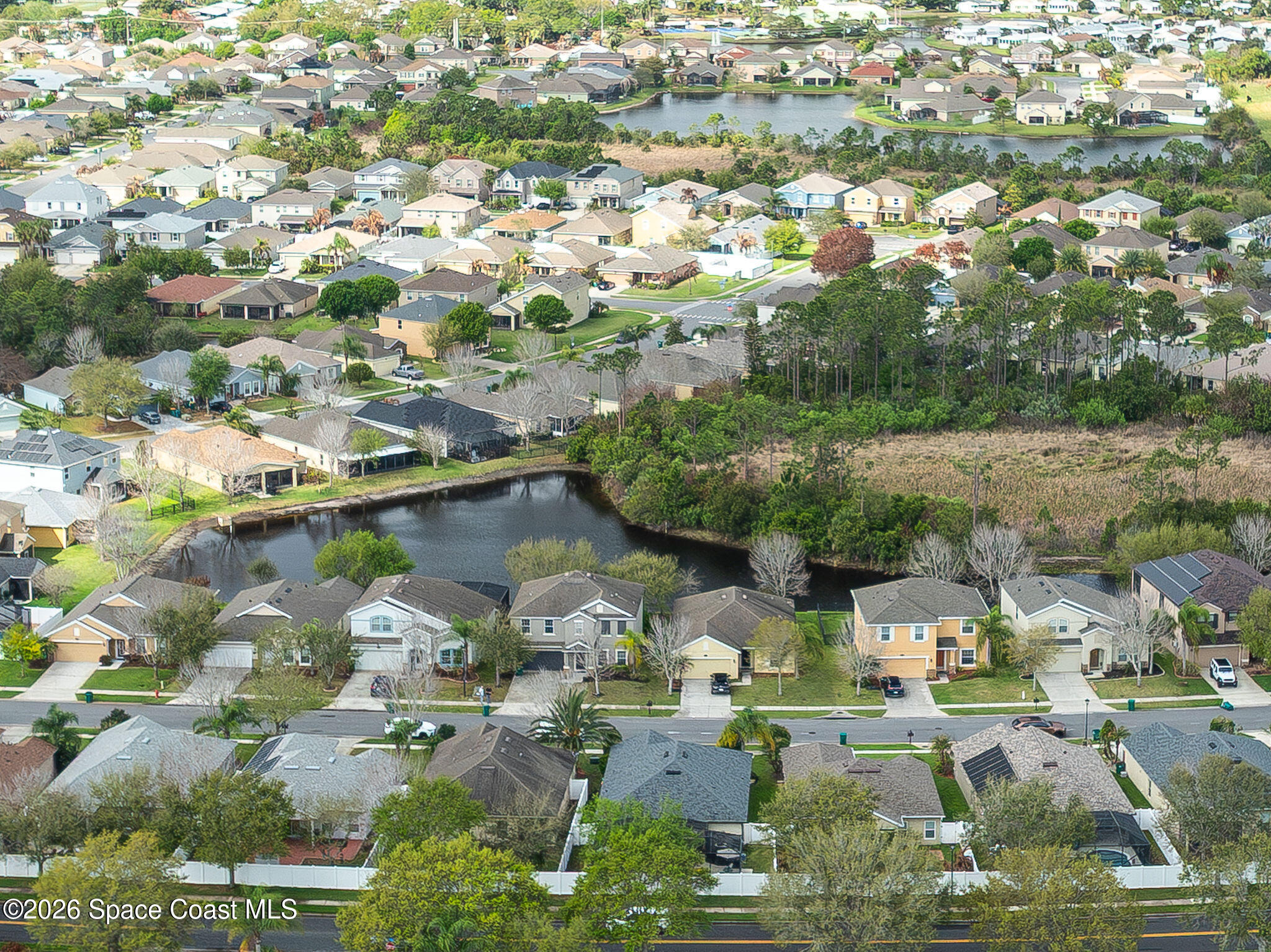3911 Joslin Way Melbourne, FL 32904 - Photo 59 of 63 an aerial view of residential houses with outdoor space