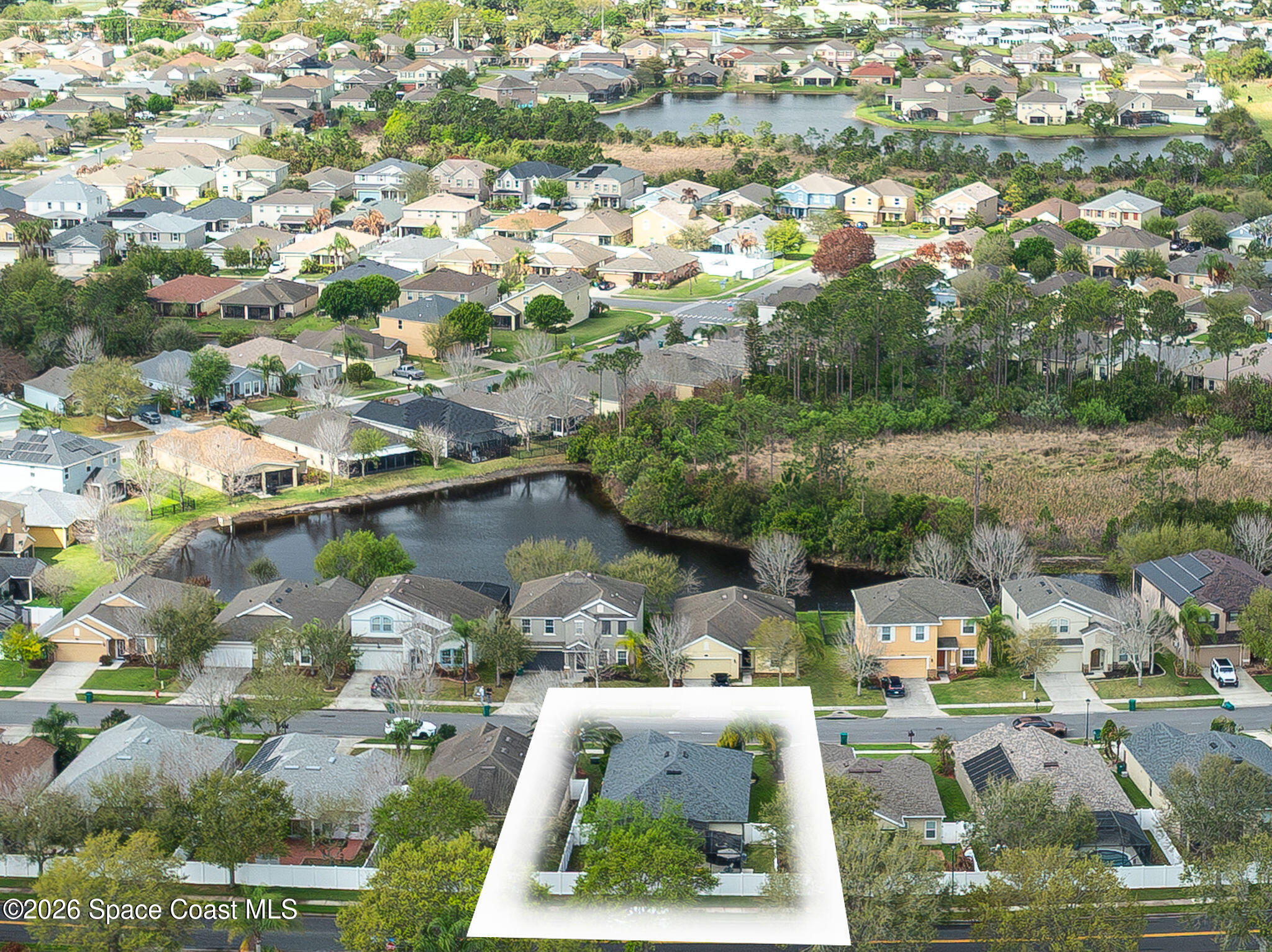 3911 Joslin Way Melbourne, FL 32904 - Photo 60 of 63 an aerial view of residential houses with outdoor space and parking