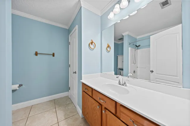 a bathroom with a sink a vanity and a mirror