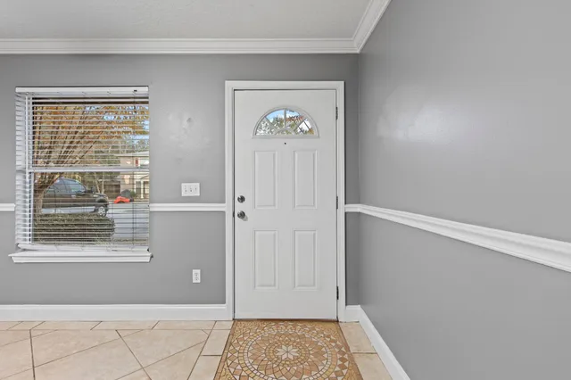 a view of an entryway with wooden floor