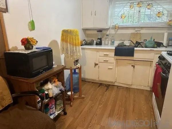 a view of a kitchen with appliances and cabinets