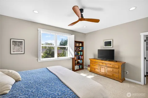 a bedroom with furniture and window