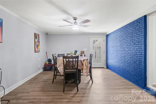 a dining room with furniture and window