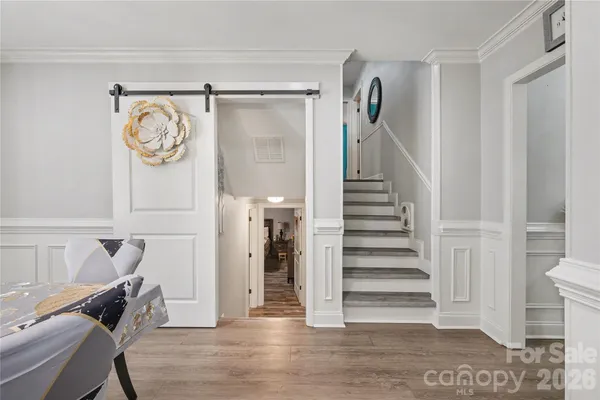 a view of entryway with wooden floor
