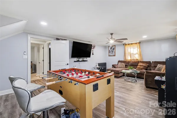 a dinning room with furniture and a flat screen tv