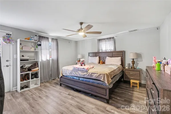 a bedroom with a bed and a book shelf