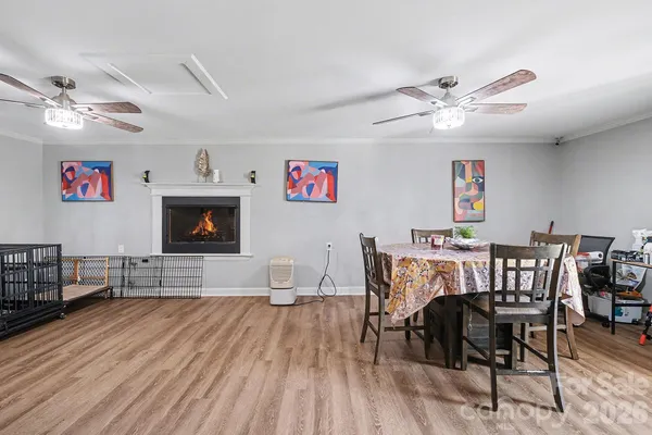 a view of a dining room with furniture wooden floor and a chandelier