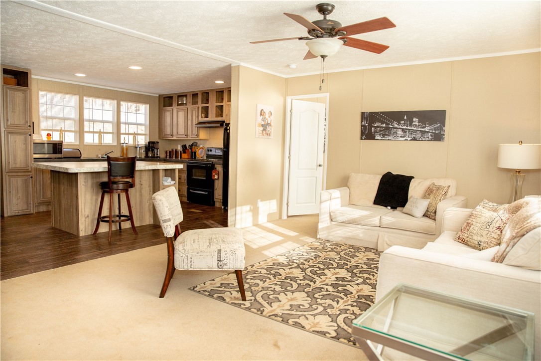 454 East Westbrook Road Seneca, SC 29678 - Photo 2 of 15 Living room opens into the kitchen and bar seating