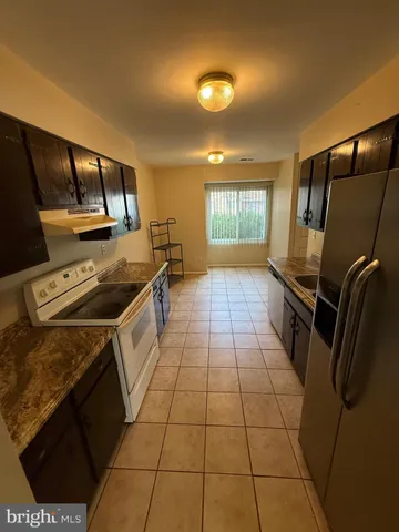 a kitchen that has a sink and a stove