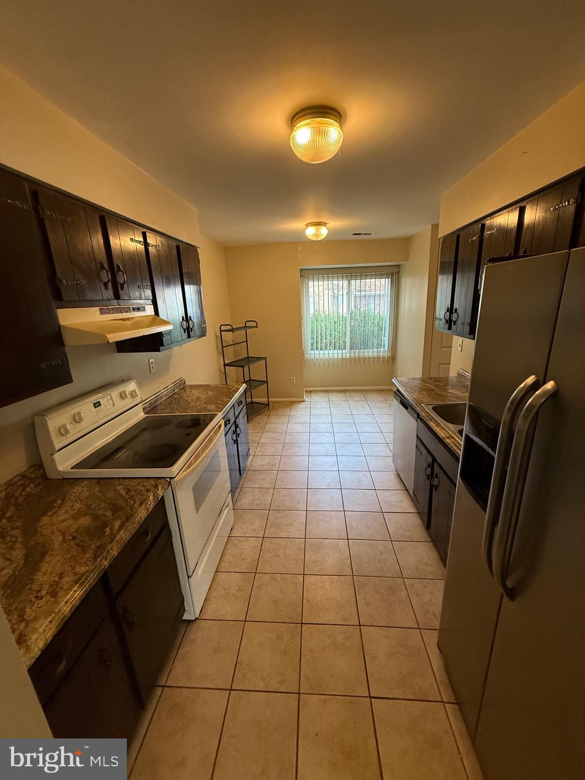 3361 Ryon Court Waldorf, MD 20601 - Photo 2 of 15 a kitchen that has a sink and a stove