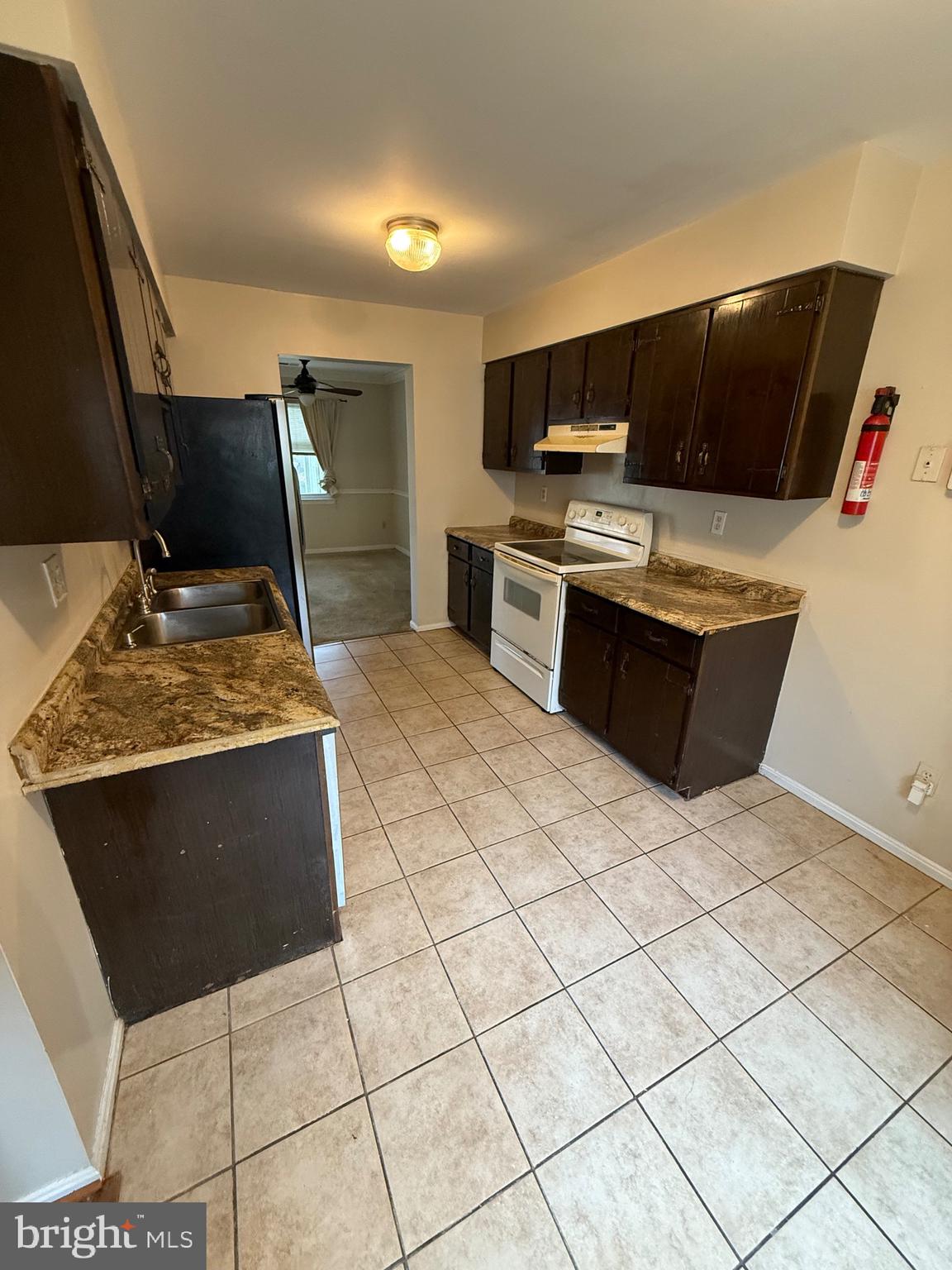 3361 Ryon Court Waldorf, MD 20601 - Photo 3 of 15 a kitchen with stainless steel appliances kitchen island granite countertop a sink and a stove
