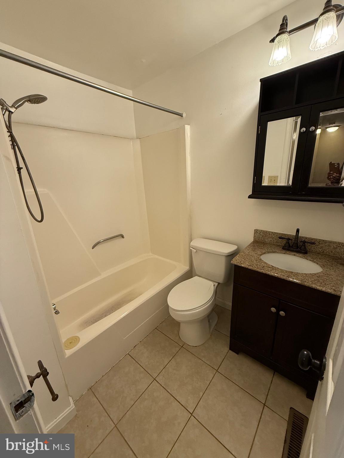 3361 Ryon Court Waldorf, MD 20601 - Photo 9 of 15 a bathroom with a granite countertop sink toilet and shower