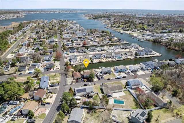 an aerial view of a city with lake view