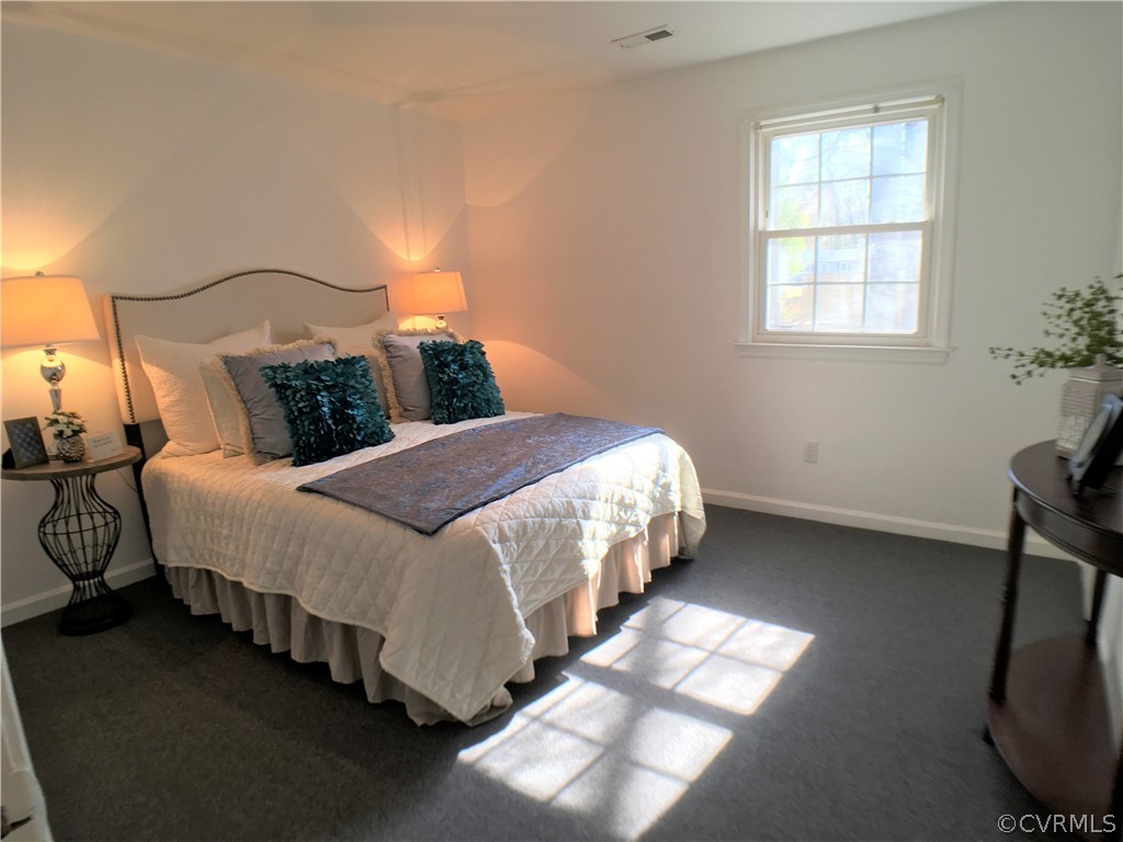 14100 South Hackberry Road Chester, VA 23836 - Photo 12 of 42 a bedroom with bed and a window