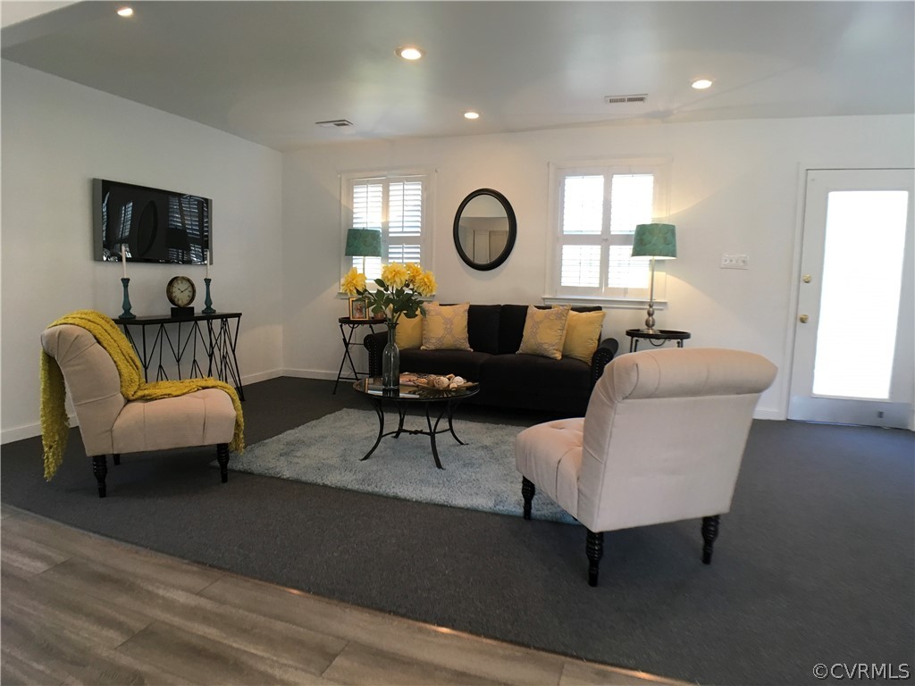 14100 South Hackberry Road Chester, VA 23836 - Photo 2 of 42 a living room with furniture a rug and a window
