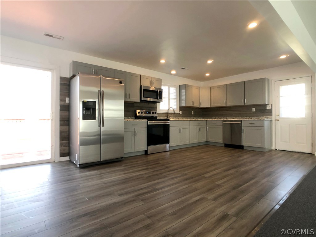 14100 South Hackberry Road Chester, VA 23836 - Photo 22 of 42 a kitchen with stainless steel appliances granite countertop a refrigerator and a stove top oven
