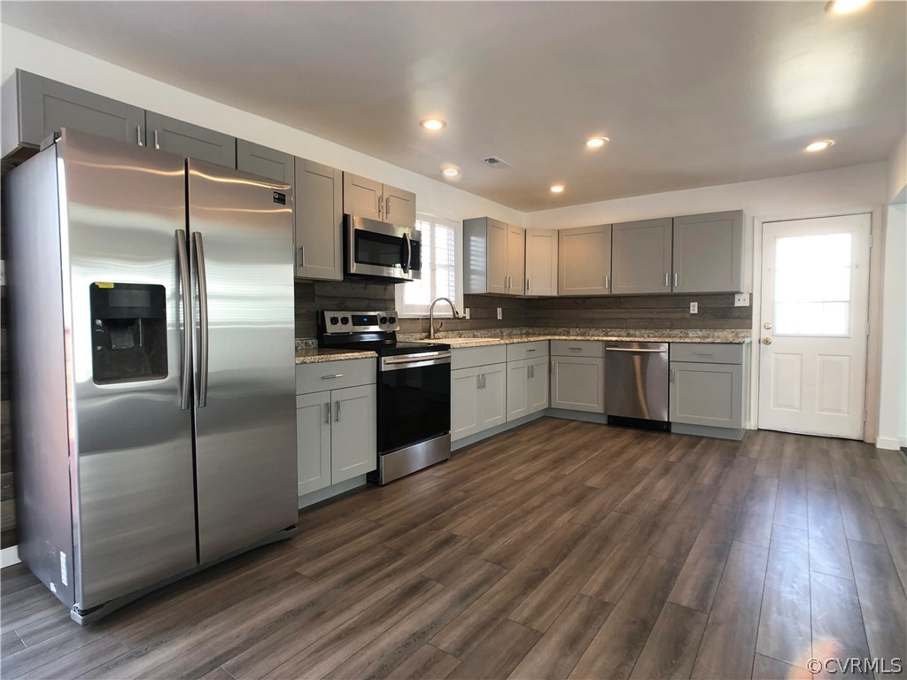 14100 South Hackberry Road Chester, VA 23836 - Photo 23 of 42 a kitchen with stainless steel appliances granite countertop a refrigerator and a stove top oven