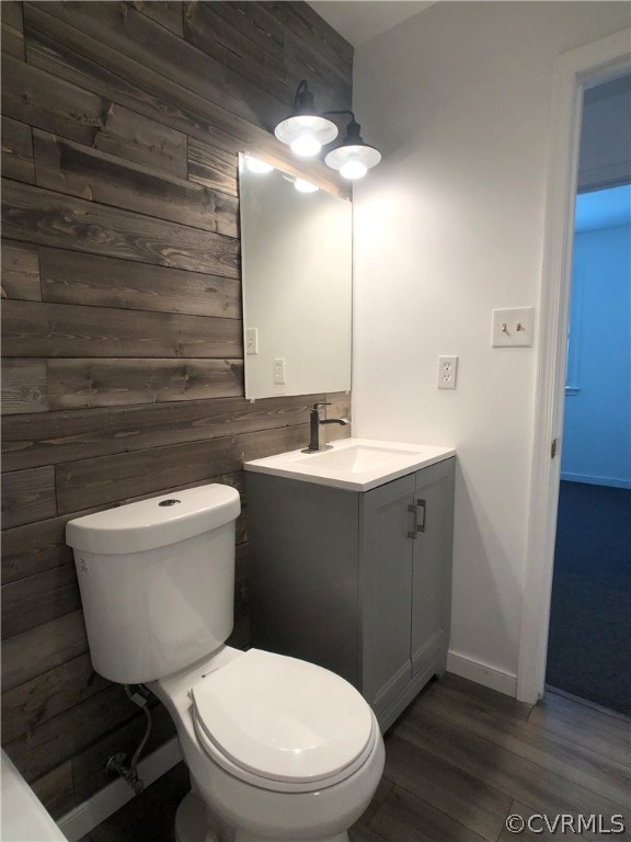 14100 South Hackberry Road Chester, VA 23836 - Photo 27 of 42 a bathroom with a toilet a sink and mirror