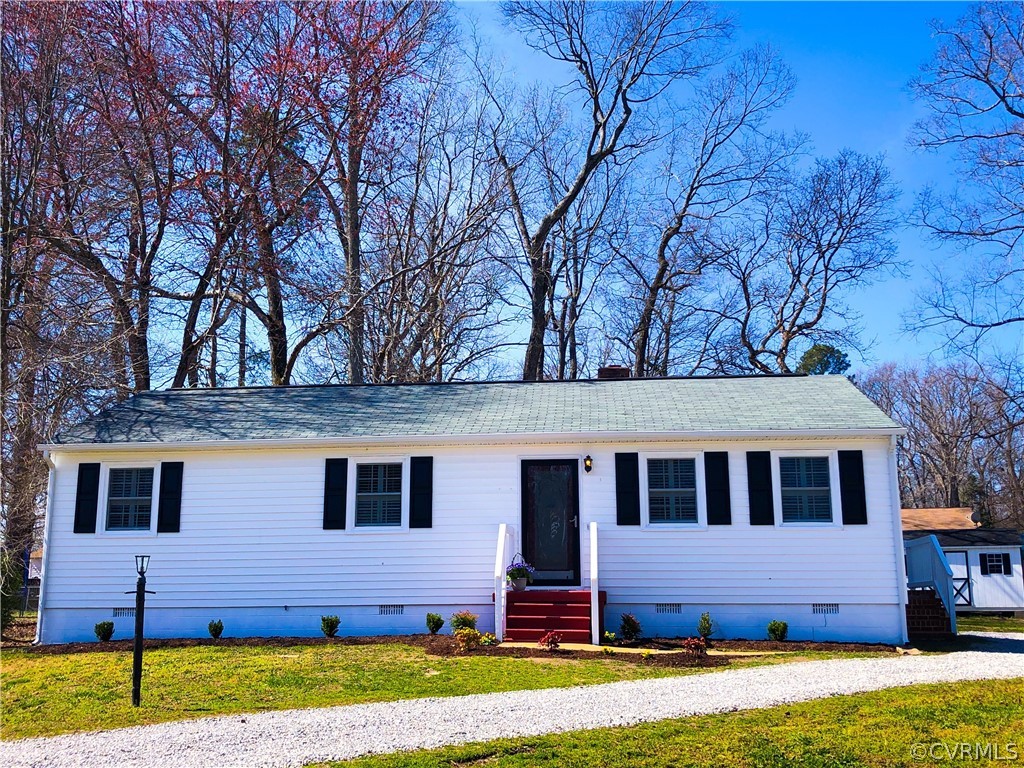 14100 South Hackberry Road Chester, VA 23836 - Photo 40 of 42 a front view of a house with a yard