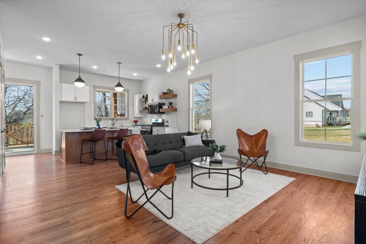 795 Jason Chapel Road Dickson, TN 37055 - Photo 1 of 35 a living room with furniture and a chandelier