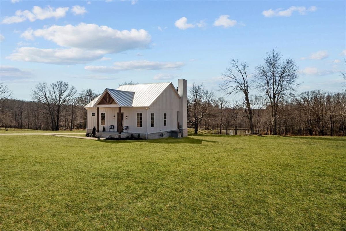795 Jason Chapel Road Dickson, TN 37055 - Photo 2 of 35 a front view of house with yard and trees in the background