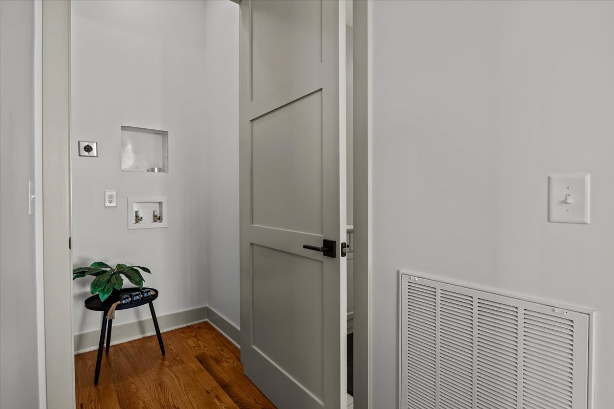 795 Jason Chapel Road Dickson, TN 37055 - Photo 21 of 35 a view of a hallway with wooden floor and a potted plant
