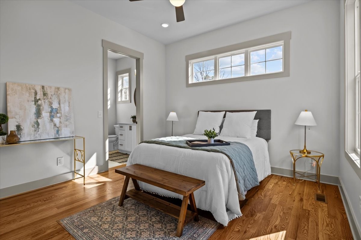 795 Jason Chapel Road Dickson, TN 37055 - Photo 22 of 35 a bedroom with a bed and wooden floor