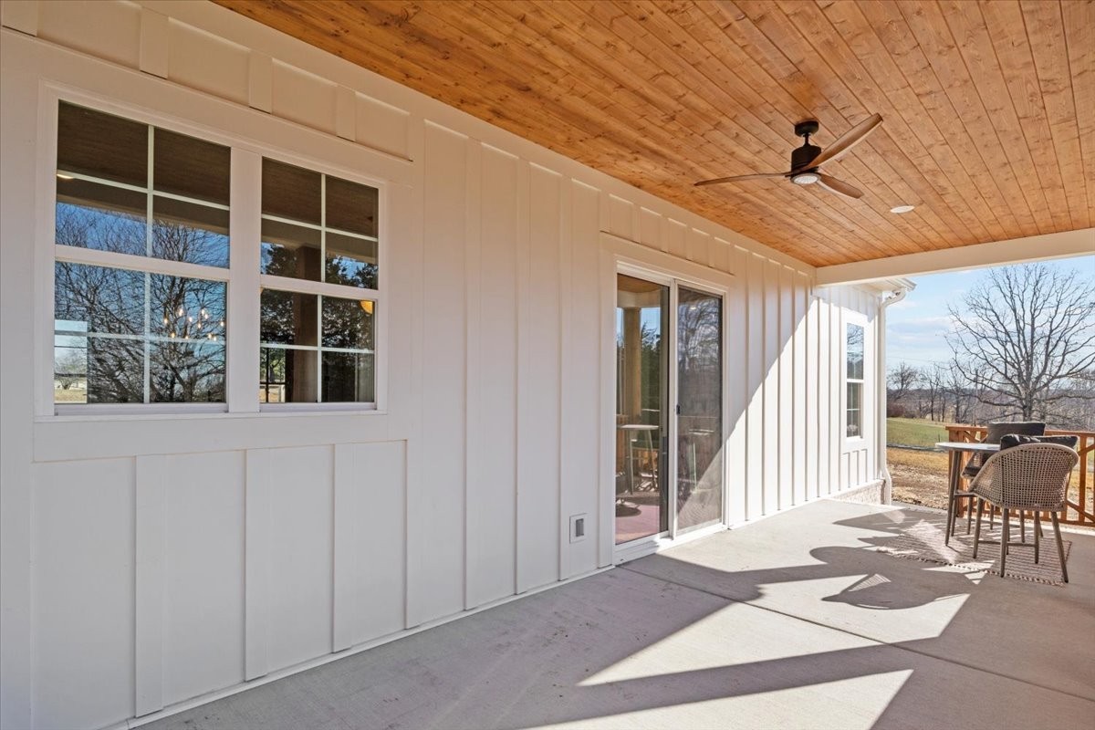 795 Jason Chapel Road Dickson, TN 37055 - Photo 31 of 35 a view of a porch with a table and chairs