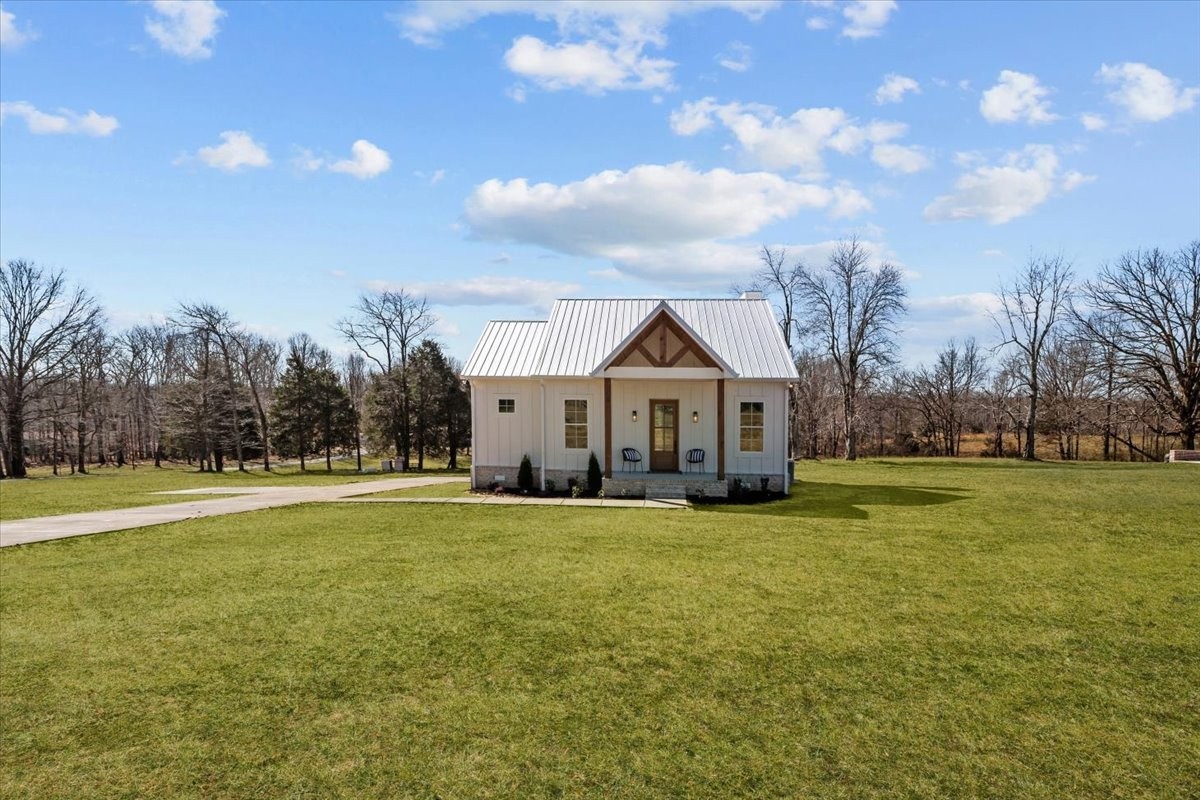 795 Jason Chapel Road Dickson, TN 37055 - Photo 5 of 35 a front view of a house with a big yard
