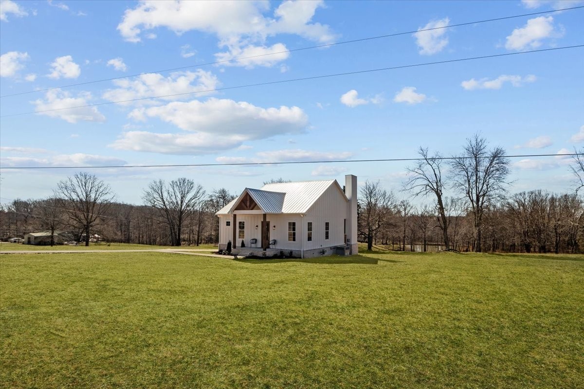 795 Jason Chapel Road Dickson, TN 37055 - Photo 6 of 35 a view of a house with yard and trees in the background