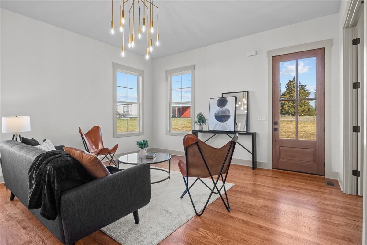 795 Jason Chapel Road Dickson, TN 37055 - Photo 10 of 35 a living room with furniture a window and a chandelier