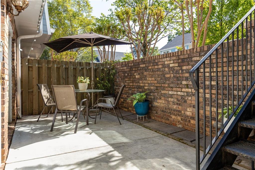 a patio with table and chairs