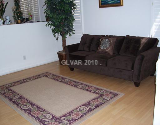 4765 Arial Ridge Street Las Vegas, NV 89147 - Photo 2 of 25 Living Room. LIVING ROOM WITH HARDWOOD FLOORING