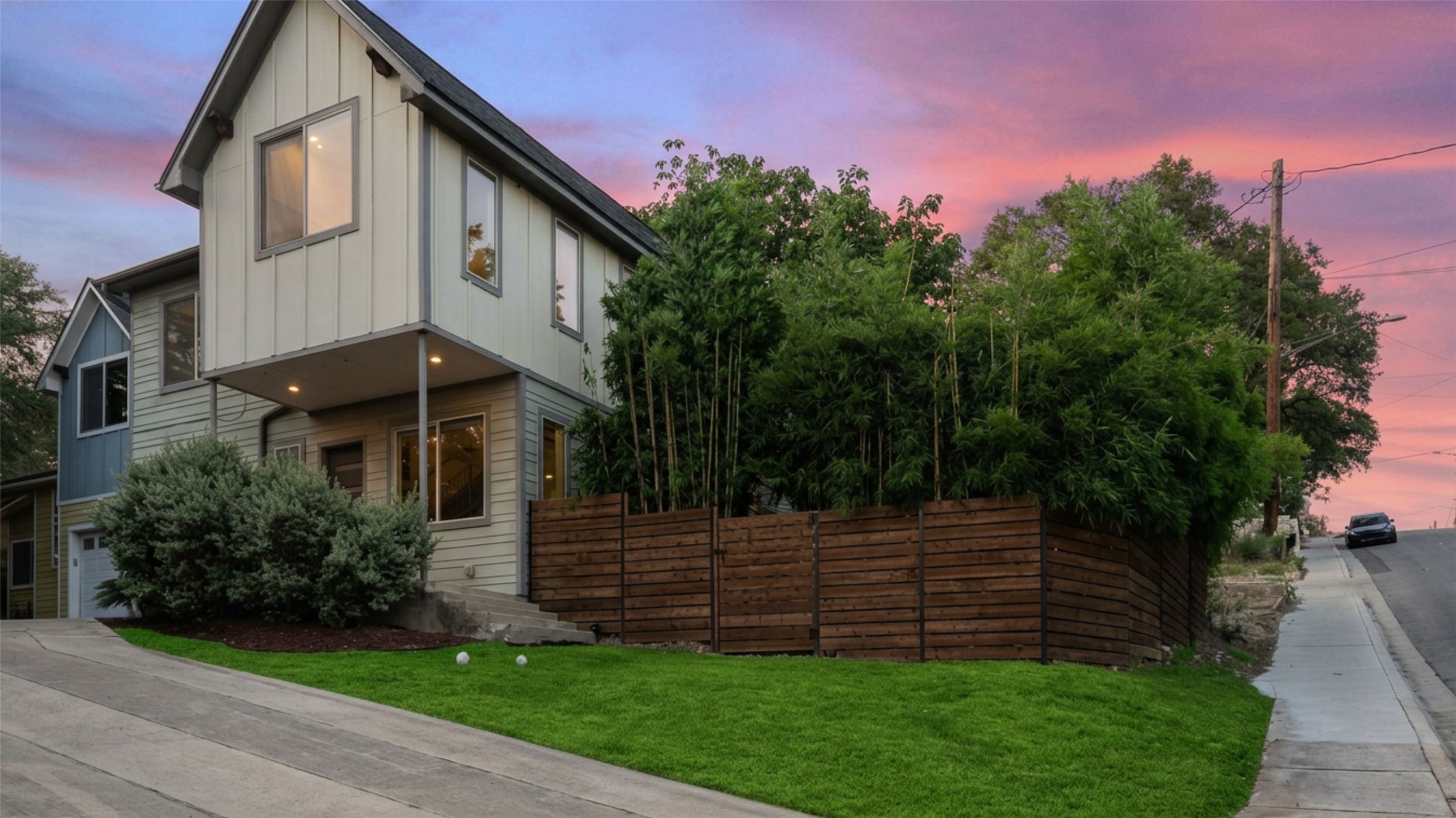 1158 Ridgeway Drive, Unit A Austin, TX 78702 - Photo 28 of 28 A striking modern facade with ample green space and a private fence creates an inviting curb appeal.