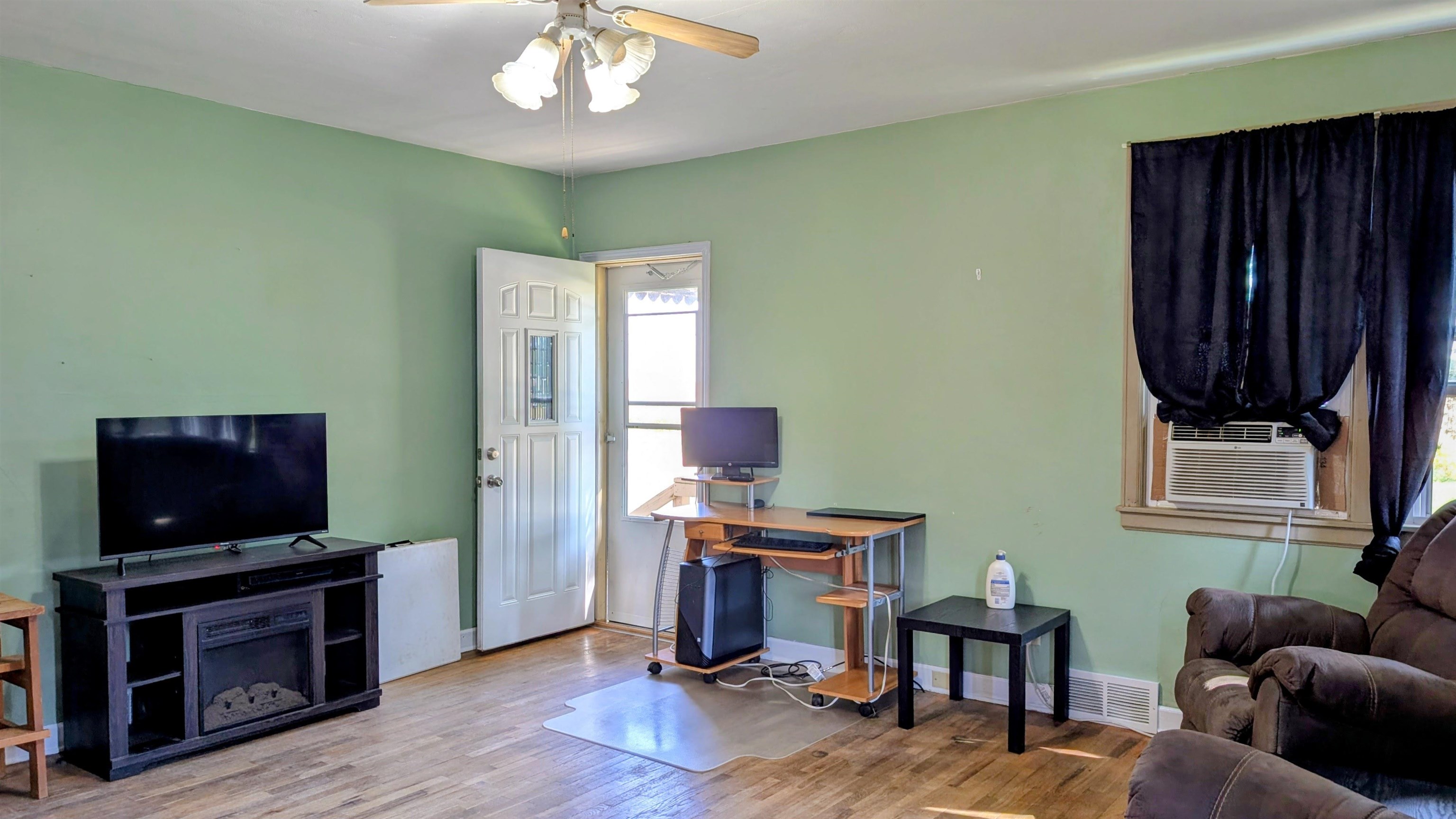 2156 North Leaf River Road Mount Morris, IL 61054 - Photo 2 of 21 a view of a livingroom with furniture and a flat screen tv