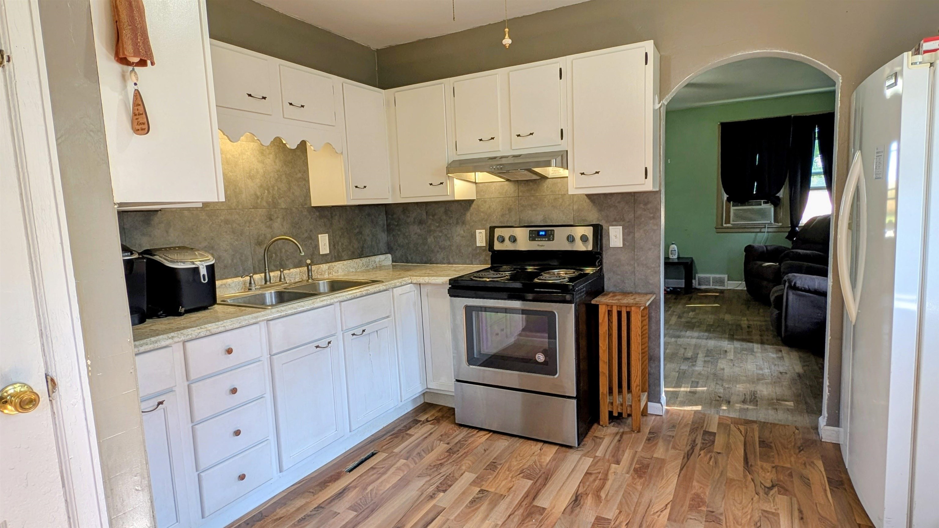 2156 North Leaf River Road Mount Morris, IL 61054 - Photo 5 of 21 a kitchen with stainless steel appliances a stove a sink and a refrigerator