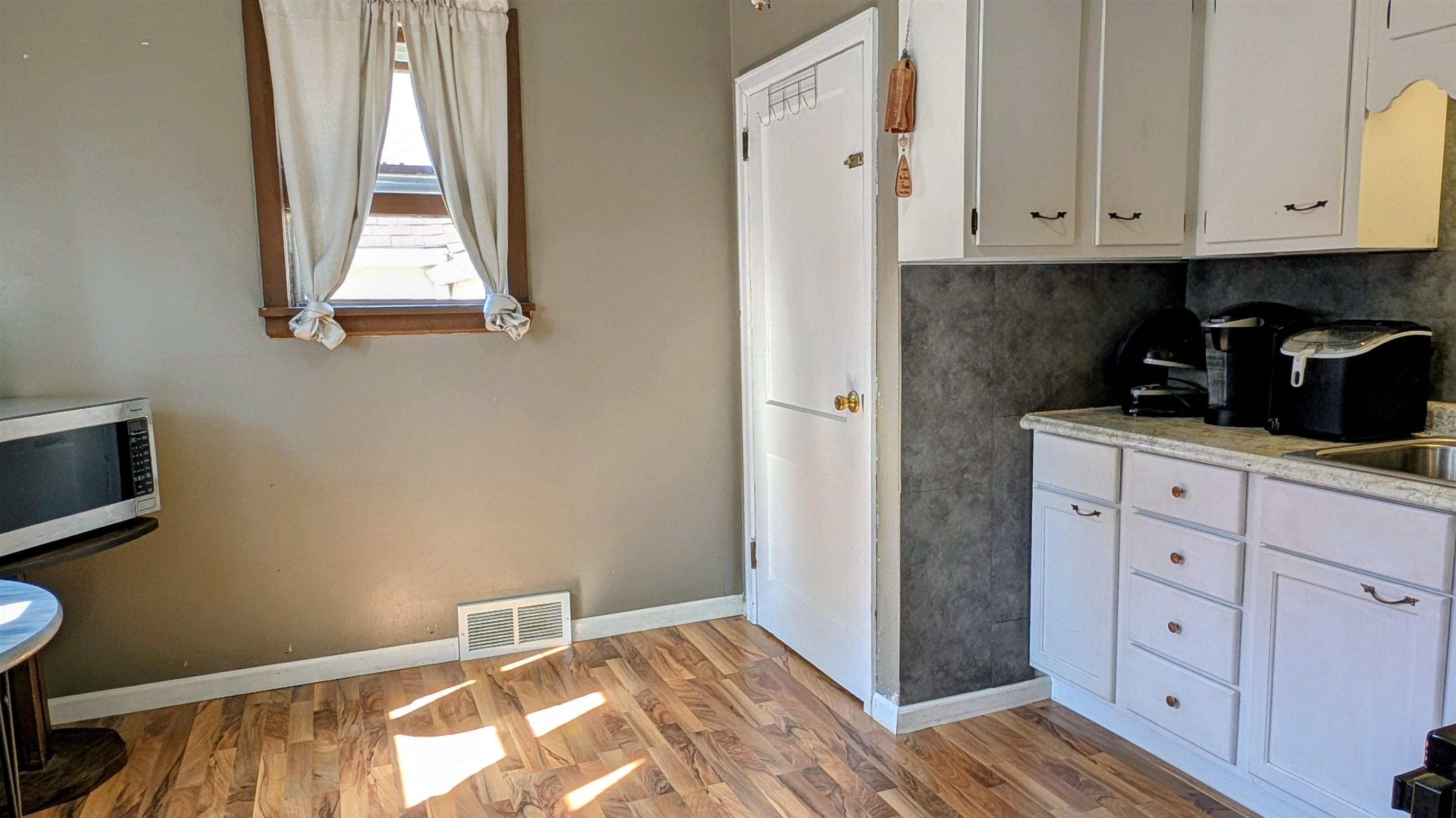 2156 North Leaf River Road Mount Morris, IL 61054 - Photo 7 of 21 a view of cabinets and window