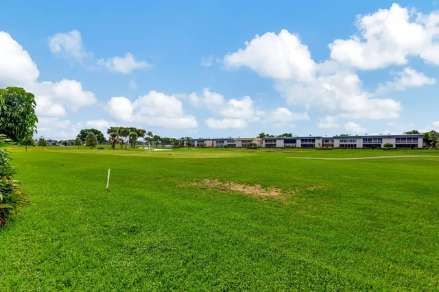 a view of a golf course with an trees