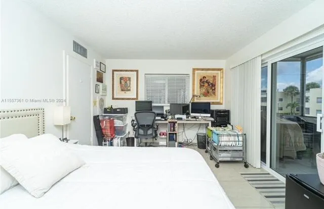 a bathroom with a shower and a sink