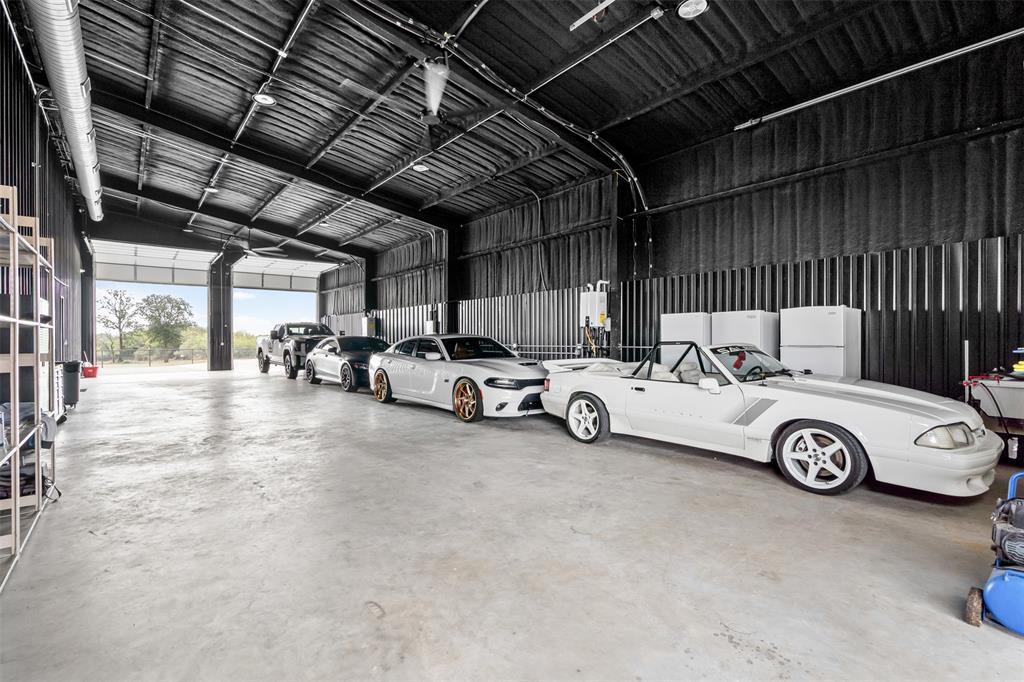 9700 Nix Road Tolar, TX 76476 - Photo 29 of 39 a view of parking garage with cars parked