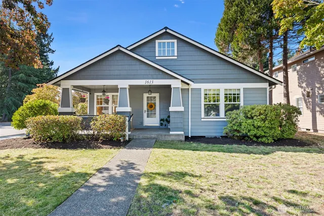 a view of a house with a yard and plants