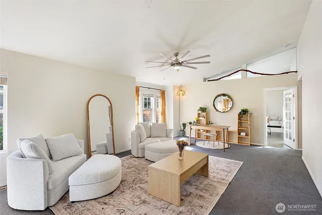 a living room with furniture and a large window